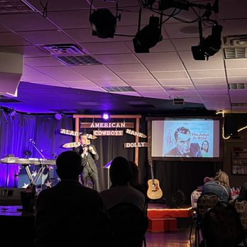 Firelight Barn Dinner Theater - a man playing guitar - Dinner Theater Near Me - Henderson, Nevada