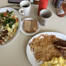 Veggie omelette breakfast and Italian sausage breakfast with toast and coffee. Yum! Veggie omelette breakfast and Italian sausage breakfast with toast and coffee. Yum!