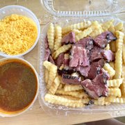 Photo of Langer's Delicatessen - Los Angeles, CA, United States. Pastrami Chili Cheese Fries - I get the cheese on the side so we can stick it in the broiler after it gets here