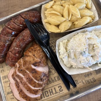 Wright’s Barbecue - Both types of house made sausage, chicken, mac and cheese, and potato salad - Barbeque Near Me - Bentonville, Arkansas Wright’s Barbecue - Both types of house made sausage, chicken, mac and cheese, and potato salad - Barbeque Near Me - Bentonville, Arkansas