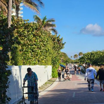 36th Street Park - Pedestrians of every age and physical capabilities share the walkway along the beach early this morning. - Parks Near Me - Miami Beach, Florida
