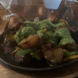 Hanger Steak with broccoli, potatoes, & peppers.