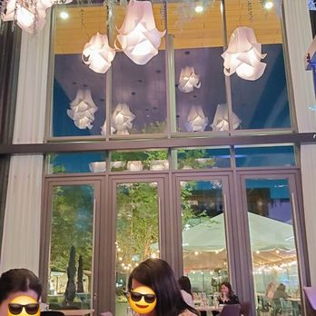 Glasshouse Kitchen - Fun decor. Loved the for to ceiling walls and flower lights. - Pizza Near Me - Research Triangle, North Carolina