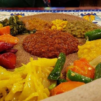 Mesob Ethiopian Restaurant - Mesob vegetarian sampler ($12.75), vegan by default. Colorful & good. Two types of lentils! Some dishes were lukewarm, though. - Ethiopian Near Me - Minneapolis, Minnesota Mesob Ethiopian Restaurant - Mesob vegetarian sampler ($12.75), vegan by default. Colorful & good. Two types of lentils! Some dishes were lukewarm, though. - Ethiopian Near Me - Minneapolis, Minnesota