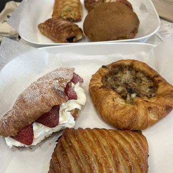 Tous Les Jours - Chocolate avalanche, strawberry croissant, mushroom and onion tart, blueberry and cream cheese finish, coffee Bomb, spinach tart, frank roll - Bakeries Near Me - Columbus, Ohio Tous Les Jours - Chocolate avalanche, strawberry croissant, mushroom and onion tart, blueberry and cream cheese finish, coffee Bomb, spinach tart, frank roll - Bakeries Near Me - Columbus, Ohio