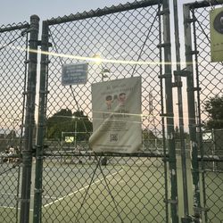 Griffith-Riverside Pay Tennis Facility - Signs on court fence