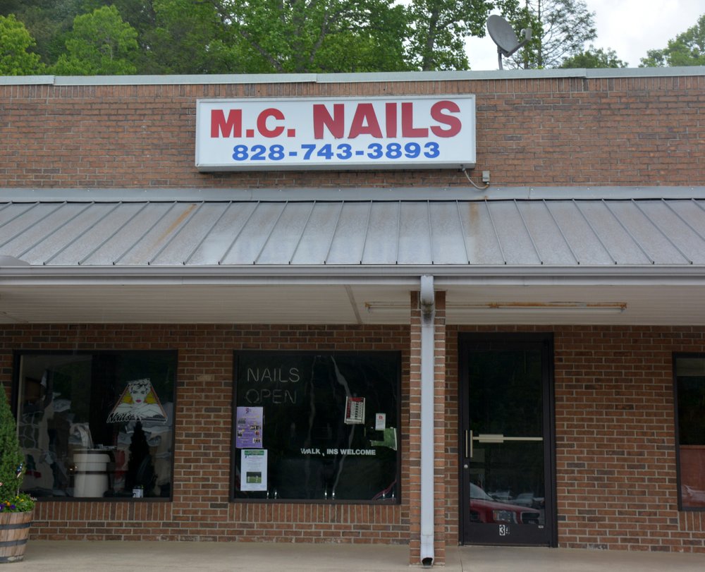 M C Nail Logo
