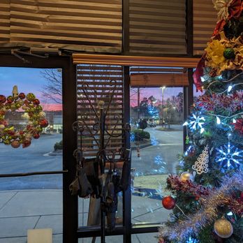 Borgo Italia - a decorated christmas tree in front of a window - Pizza Near Me - Senoia, Georgia