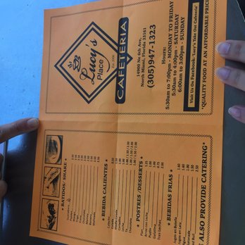 Lucy's Take Out Cafeteria - a person holding a menu - Cuban Near Me - Miami, Florida Lucy's Take Out Cafeteria - a person holding a menu - Cuban Near Me - Miami, Florida