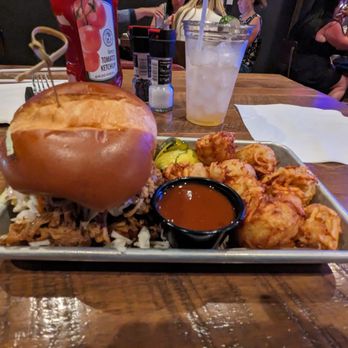 Ole Red - Pulled pork sandwich with tater tots. 16 dollars - Southern Near Me - Orlando, Florida Ole Red - Pulled pork sandwich with tater tots. 16 dollars - Southern Near Me - Orlando, Florida
