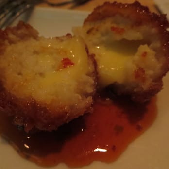 Seed Kitchen & Bar - White Corn Grit Fritters - jalapeno jelly, Thomasville tomme. - American Near Me - Marietta, Georgia Seed Kitchen & Bar - White Corn Grit Fritters - jalapeno jelly, Thomasville tomme. - American Near Me - Marietta, Georgia