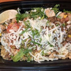Brito's Burrito - Chicken burrito bowl with mexican rice, pinto beans, pico de gallo, corn salsa, mild salsa, cilantro, & lime wedge.