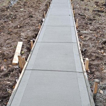 Santos T Construction - a concrete walkway being built in front of a house - Roofing Near Me Santos T Construction - a concrete walkway being built in front of a house - Roofing Near Me