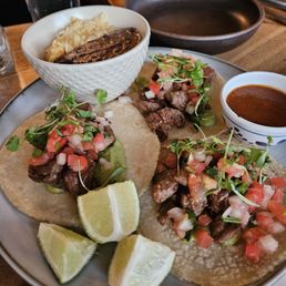 Steak tacos with rice and beans.