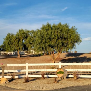 AM Kerbing - a white fence with a tree in the background - Landscaping Near Me - Murrieta, California AM Kerbing - a white fence with a tree in the background - Landscaping Near Me - Murrieta, California