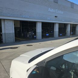 The empty auto care center that says APPOINTMENT ONLY!
