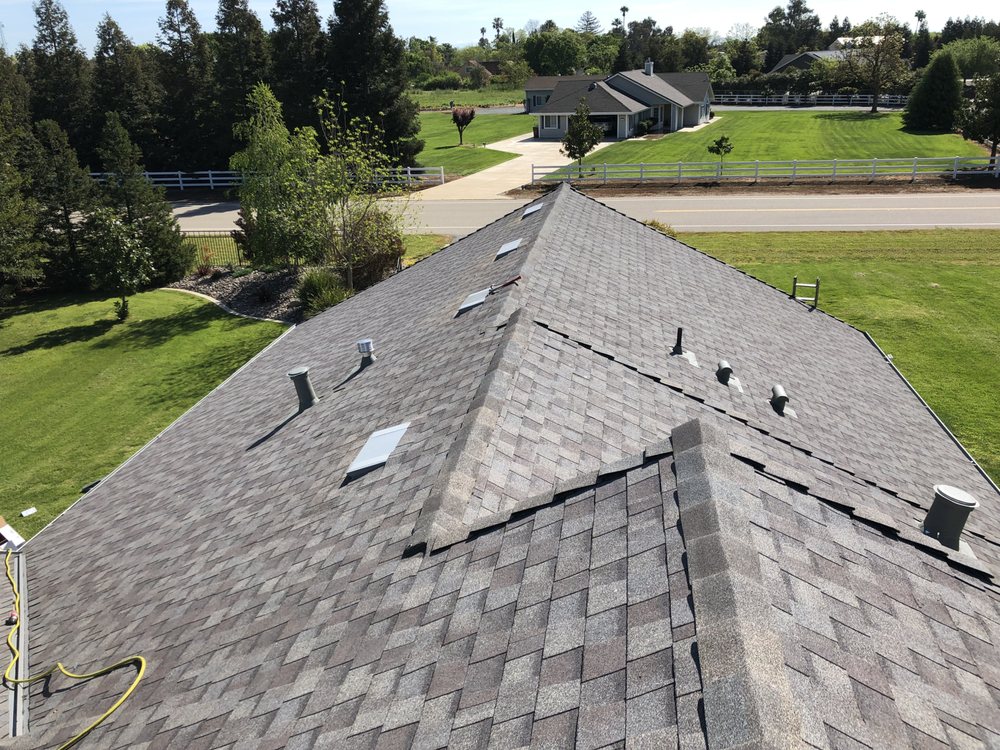 Slide of New Era Roofing