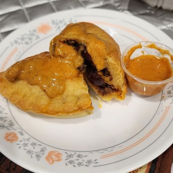 Rosi's Alfajores - Rosi's beef empanada with hot sauce - Desserts Near Me - Daly City, California Rosi's Alfajores - Rosi's beef empanada with hot sauce - Desserts Near Me - Daly City, California