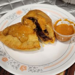 Rosi's beef empanada with hot sauce