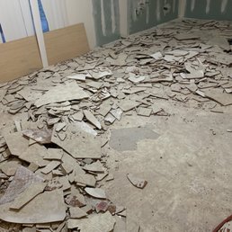 Before picture of Kitchen area with broken tile.