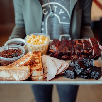 City Barbeque - a person holding a tray of food - Barbeque Near Me - Solon, Ohio
