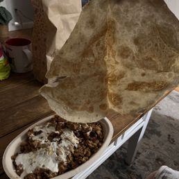 Half a crusted tortilla which was paid for as an extra Half a crusted tortilla which was paid for as an extra