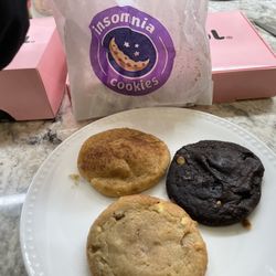 Insomnia Cookies - Against the backdrop of Crumbl cookie boxes. (We were doing one of our famous taste test comparisons. ;)