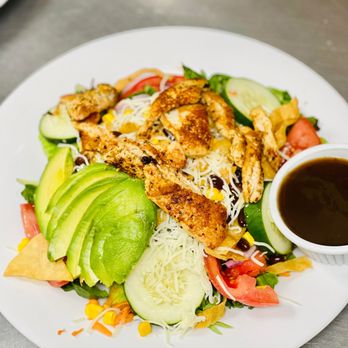 yolk cafe - a chicken salad with avocado, tomatoes, cucumber, and corn - New American Near Me - Naples, Florida yolk cafe - a chicken salad with avocado, tomatoes, cucumber, and corn - New American Near Me - Naples, Florida