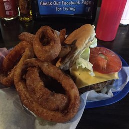 Holy shit!!  There are 2 1/4 pound patties under that mountain of onion rings!  Those are totally Zips onion rings!!  Unhinge your jaw!