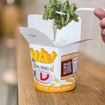 Dal Moro's Fresh Pasta To Go - a hand holding a fork with a piece of broccoli sticking out of it - Italian Near Me - Ottawa, Ontario Dal Moro's Fresh Pasta To Go - a hand holding a fork with a piece of broccoli sticking out of it - Italian Near Me - Ottawa, Ontario