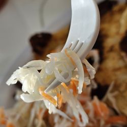 Pupuseria Las Delicias - Close-up of a fork holding a piece of the curtido.