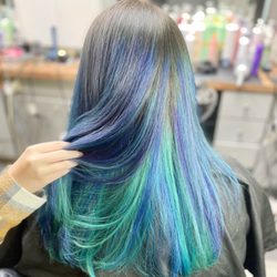 Evolve Artistry and Salon - Mermaid vibes for sure with this purple, teal and indigo hair color!