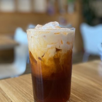 Lotus & Light - My Thai Iced Tea. These 2 idiot parents let their kids try to climb the wooden decor in the background. - Vietnamese Near Me - Burbank, California