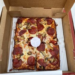 Four 4 Corner Pizza with pepperoni and mushroom