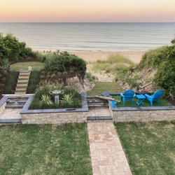 Woodland Lawn Care - Beach front property transformed salt tolerant plants and turf.