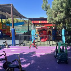 Little Prodigy Preschool & Daycare Center - The Little Prodigy Preschool and Daycare Center race track with tricycles and play cars.