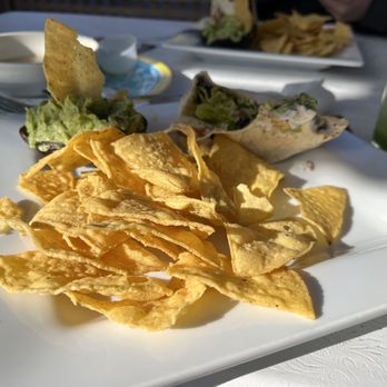 Sunfrost Farms - Chips in the forefront - black bean burrito in the back. - Fruits & Veggies Near Me - Woodstock, New York Sunfrost Farms - Chips in the forefront - black bean burrito in the back. - Fruits & Veggies Near Me - Woodstock, New York