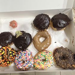 Donut King - One bite of the two cherry donuts, sorry that's all that was left. Boston cream, maple, Reeses, sprinkles, nerds, Butterfinger donuts.