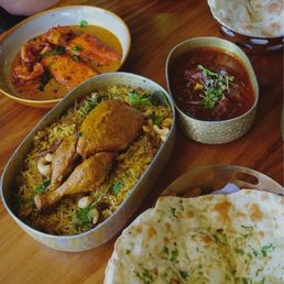Chicken Biryani, MANGO FISH & PRAWN CURRY, goat curry, and naan Chicken Biryani, MANGO FISH & PRAWN CURRY, goat curry, and naan