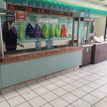 Wateria - a woman standing at a counter in a restaurant - Water Stores Near Me - Van Nuys, California