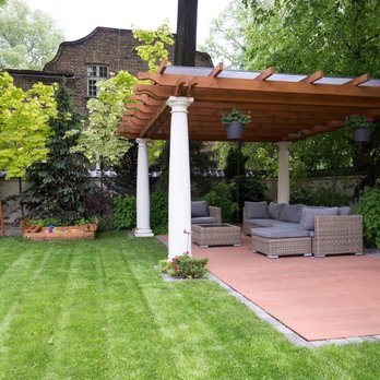 Busy Bees Landscaping - a patio with a pergolated roof - Landscaping Near Me Busy Bees Landscaping - a patio with a pergolated roof - Landscaping Near Me