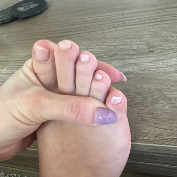 Pink Polish - Gel pedicure. Only did 2 coats of polish, didn't let it dry and it was all over my skin. Also note how they cut and filed my nails. - Nail Salons Near Me - Ruston, Washington
