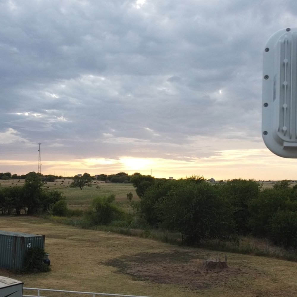 OneSource Communications - OneSource antenna. You can barely see it's tower in the center, about 5 miles away, right near the sun. - Internet Service Providers Near Me - Keller, Texas