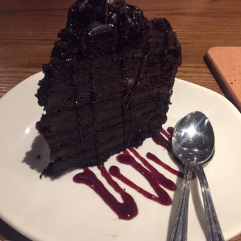 Outback Steakhouse - This chocolate cake is enough for 2 people and not over powering. It's berry sauce was a great touch - Steakhouses Near Me - Visalia, California Outback Steakhouse - This chocolate cake is enough for 2 people and not over powering. It's berry sauce was a great touch - Steakhouses Near Me - Visalia, California
