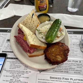 Poppies Restaurant & Deli - Hot Corned Beef Sandwich, potato Pancake, Applesauce, Coleslaw and a Pickle lol! - Delis Near Me - Delray Beach, Florida Poppies Restaurant & Deli - Hot Corned Beef Sandwich, potato Pancake, Applesauce, Coleslaw and a Pickle lol! - Delis Near Me - Delray Beach, Florida