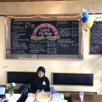 Aphrodite's Organic  Pie Shop - Pie menu board and tables that make for nice work stations. - Gluten-Free Near Me - Vancouver, British Columbia