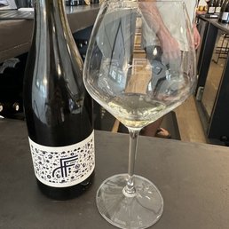 a glass of wine and a bottle of wine