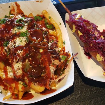Wisconsin State Fair - L-R: loaded pulled pork fries ($10) and the Sconnie Slugger (a cheesecurd corndog, $12). DELICIOUS - Festivals Near Me - West Allis, Wisconsin
