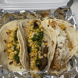 Tacos Yeah - Carné Asada with charred street corn and house chimichurri/pulled pork carnitas tacos