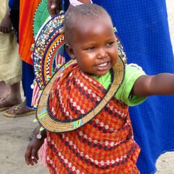 Escapes Unlimited - A Masai child in a village in Tanzania.